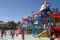 The 300-gallon bucket starts to tip over at the top of the Joker Soaker play area at Legoland Florida's water park.