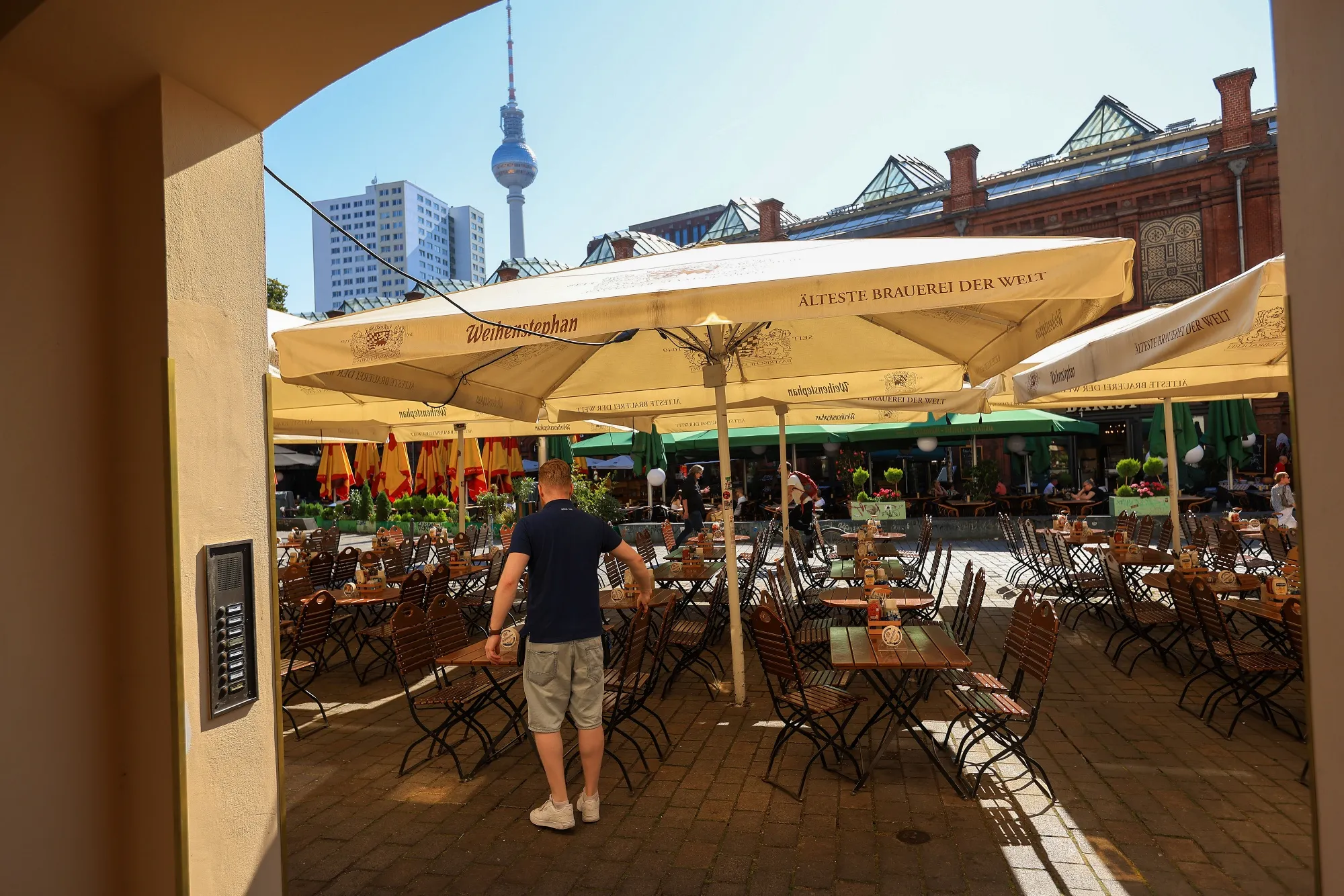 Empty tables at a restaurant in Hackescher Market in Berlin.