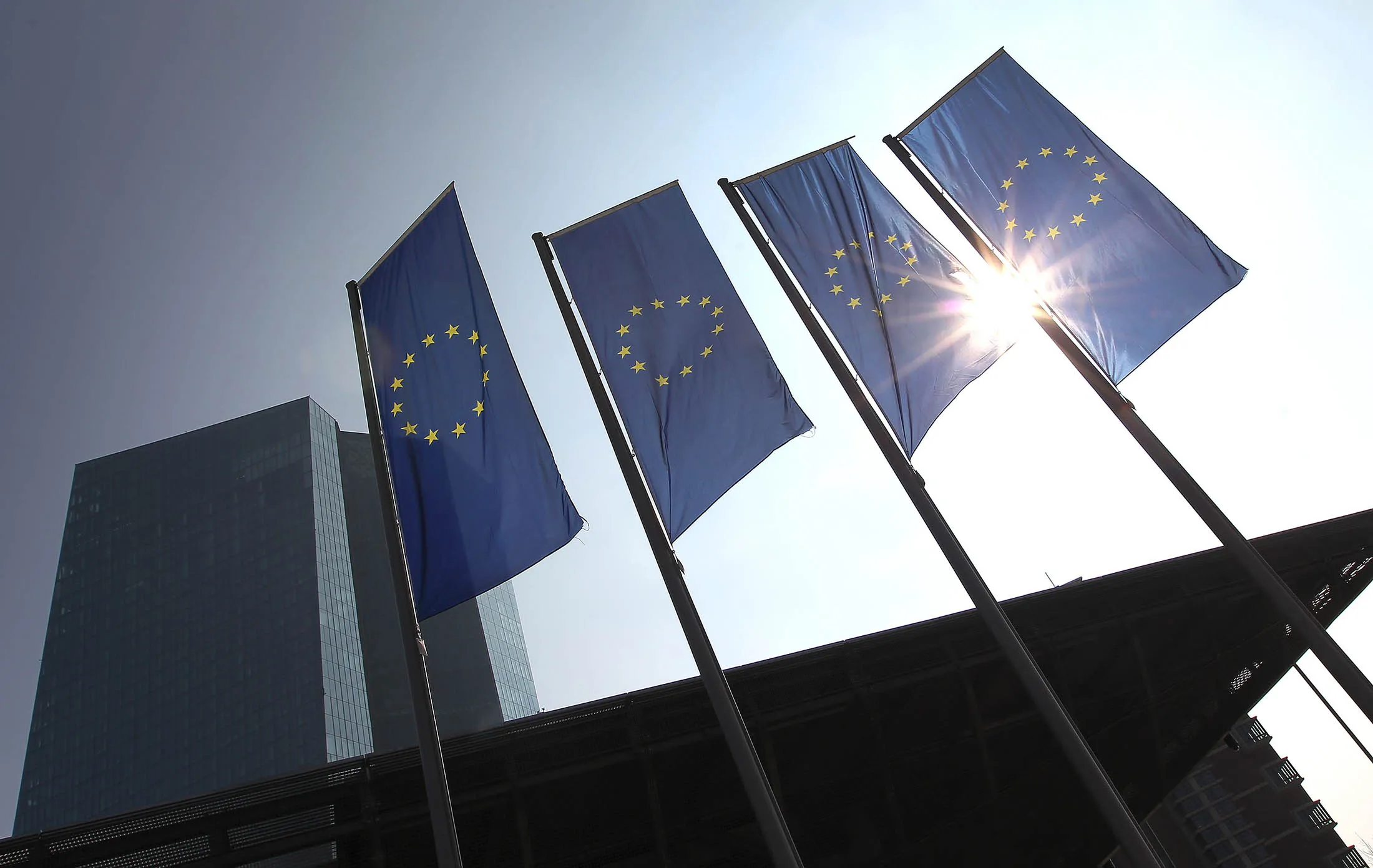 European flags flutter in front of the headquarters of the European Central Bank (ECB) in Frankfurt am Main, western Germany, on March 10, 2016. The European Central Bank cut all three of its key interest rates and beefed up its controversial asset purchase programme in a bid to kickstart chronically low inflation in the euro area. / AFP / DANIEL ROLAND (Photo credit should read DANIEL ROLAND/AFP/Getty Images)
