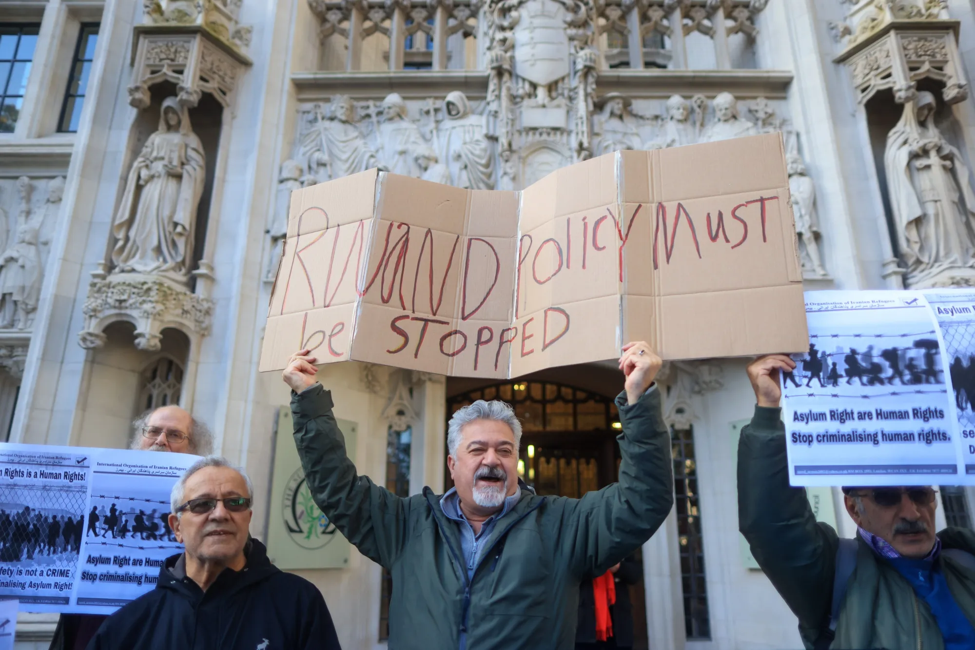 Protesters celebrate a ruling againt the government’s Rwanda deportation plan outside the UK Supreme Court in London in November.