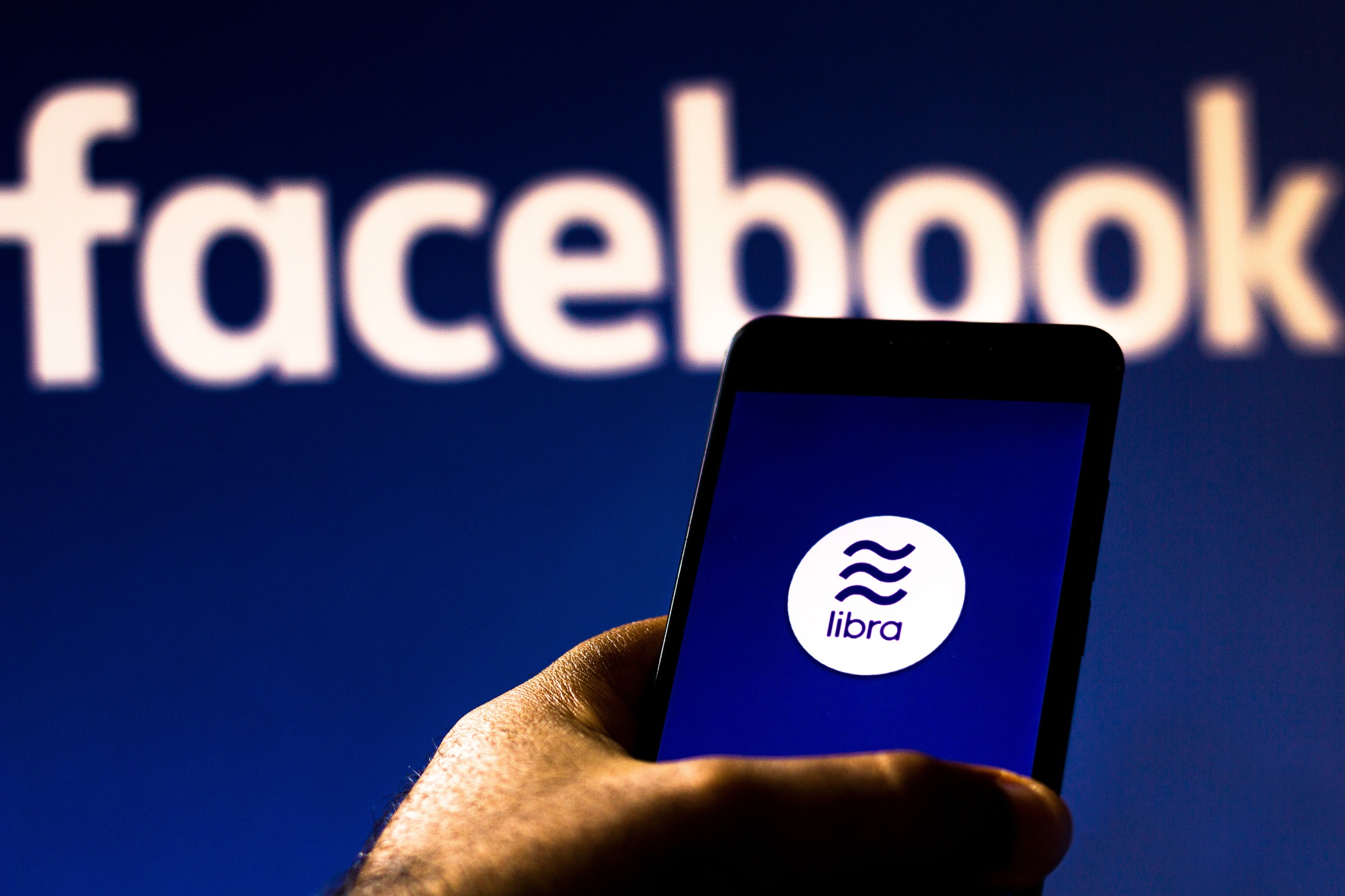 Facebook Libra logo displayed on a smartphone.
