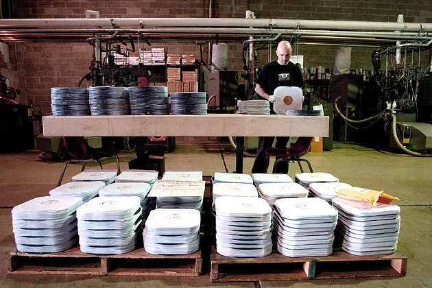 An employee prepares records for shipping at Brooklynphono vinyl, a record production facility in New York