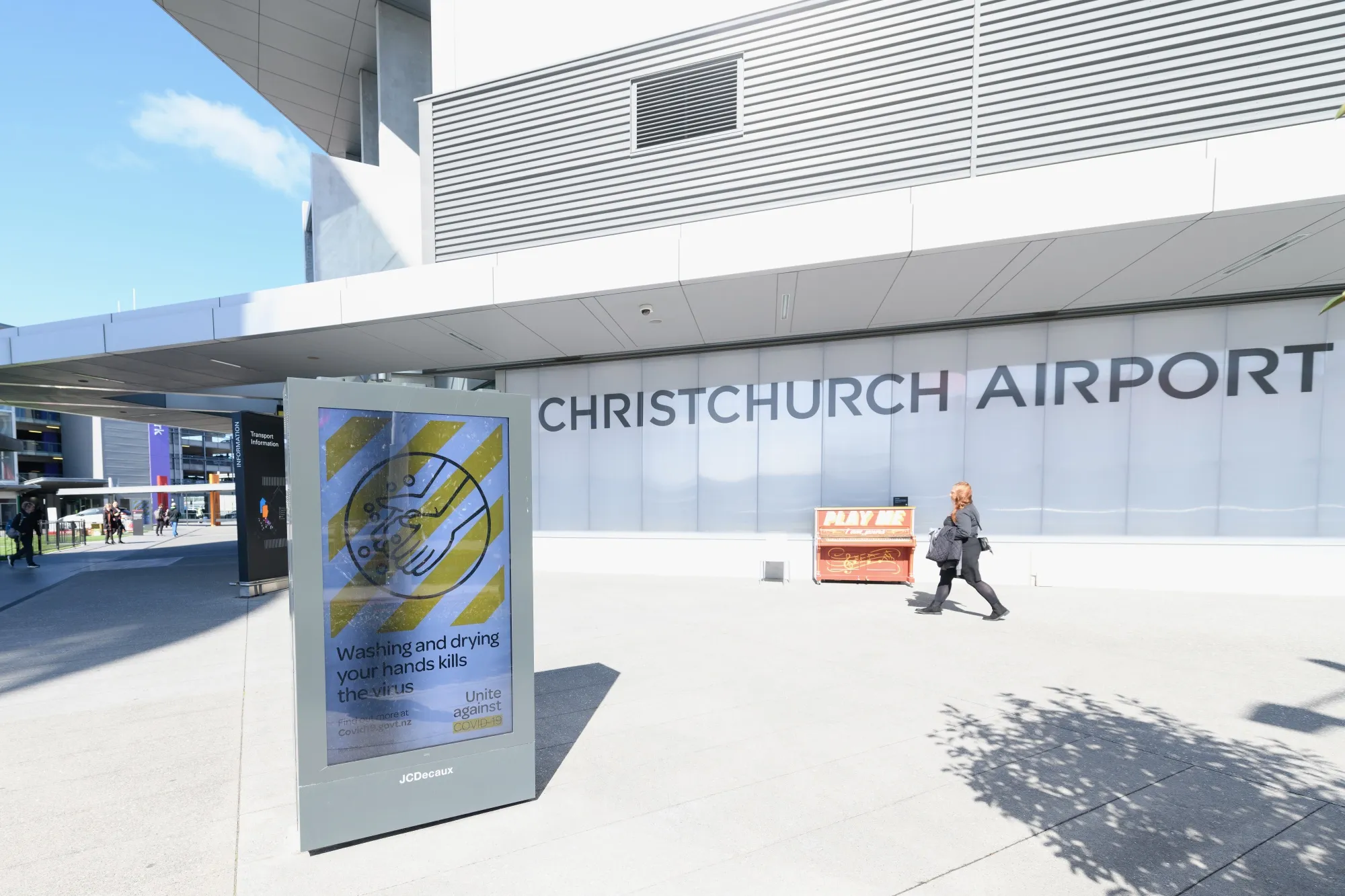 A sign saying washing and drying your hands kills the virus is seen at Christchurch International Airport in New Zealand on March 18.