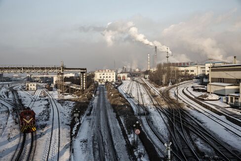Train tracks leading to the plant.
