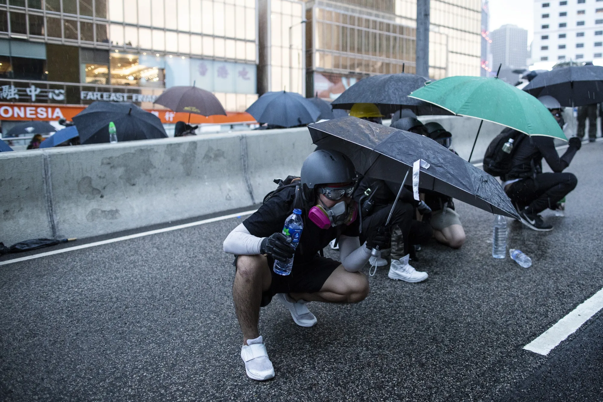 Demonstrators clash with riot police outside the Central Government Offices on Aug. 31.