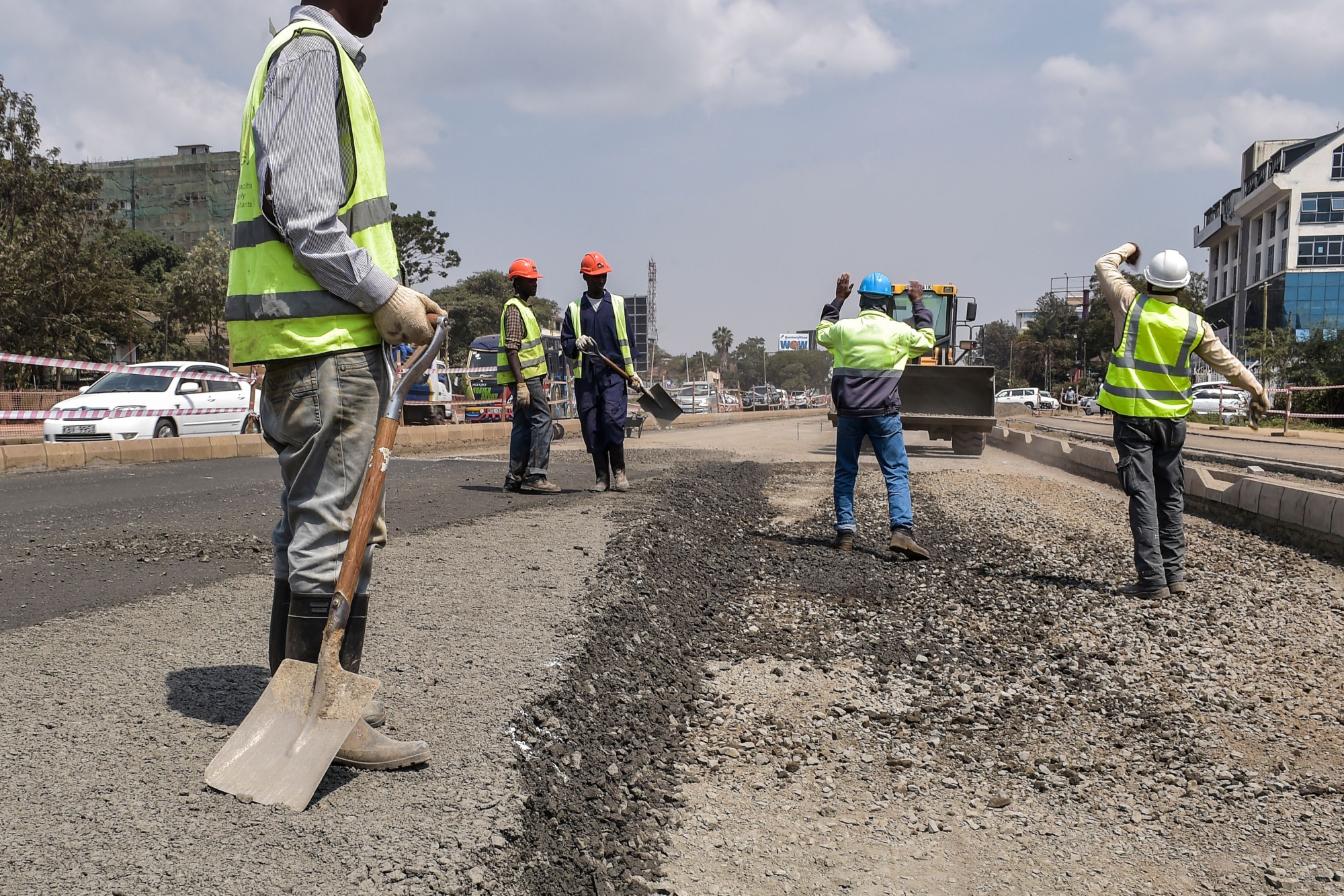 Road contractors work in Nairobi.