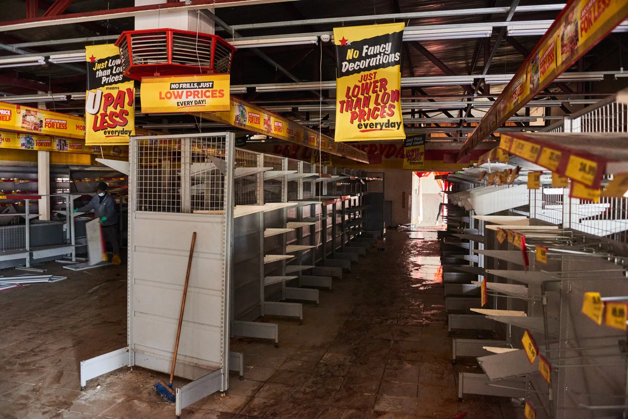 Empty shelves inside a Shoprite Holdings Ltd. USave supermarket following rioting in the Soweto district of Johannesburg.