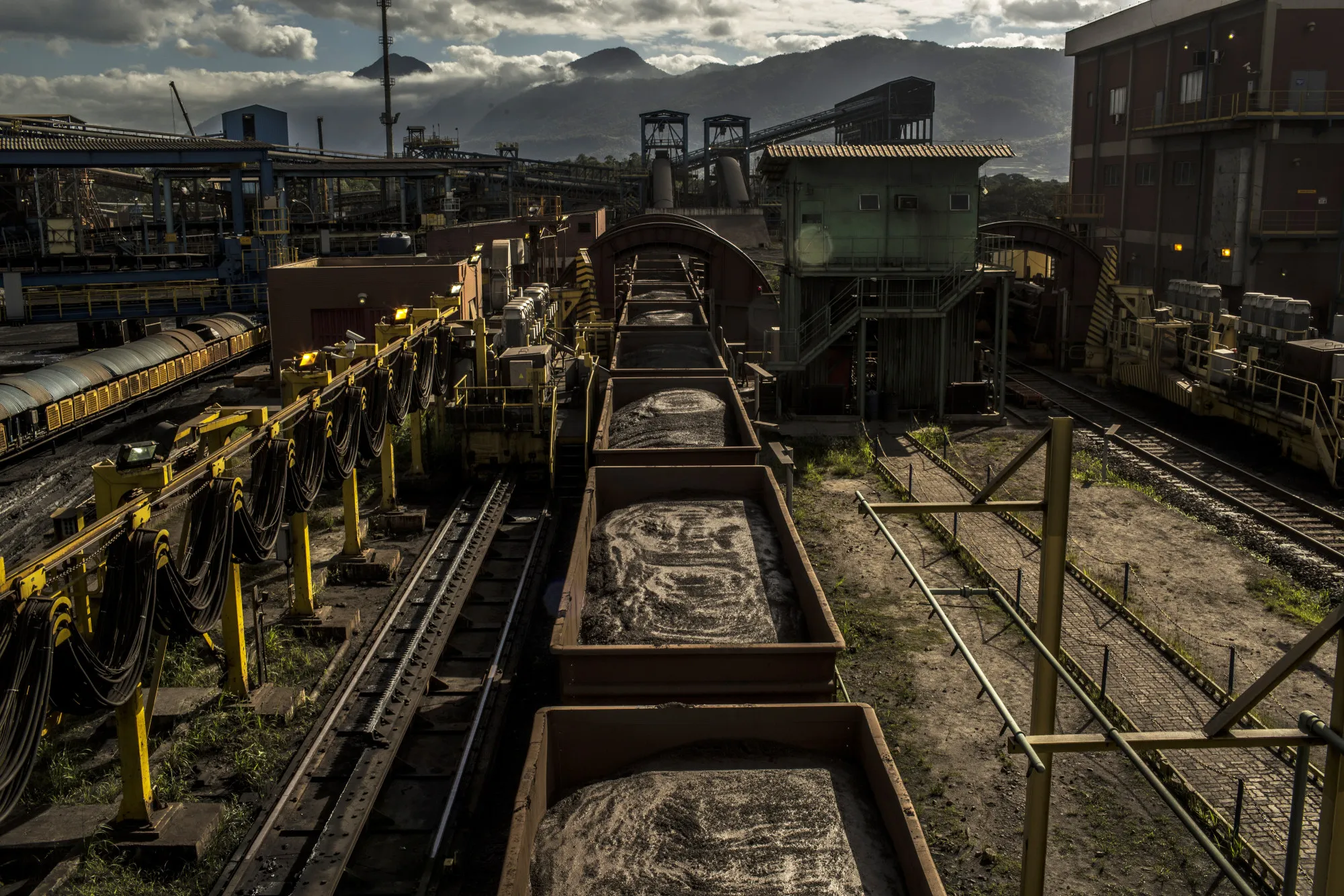 Rail cars filled with iron ore train arrive at the Tecar iron ore and coal port in Sepetiba bay in Rio de Janeiro.