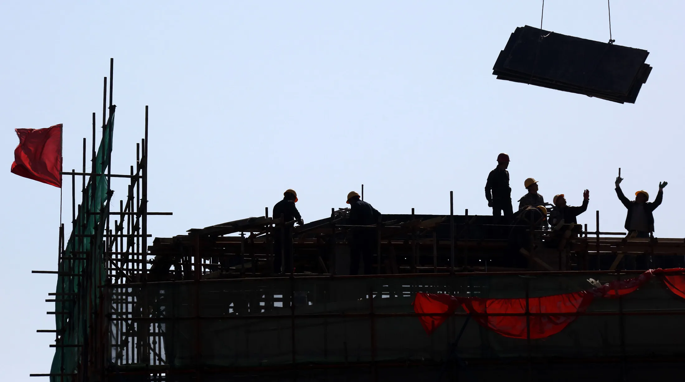Workers on a construction site in Beijing.
