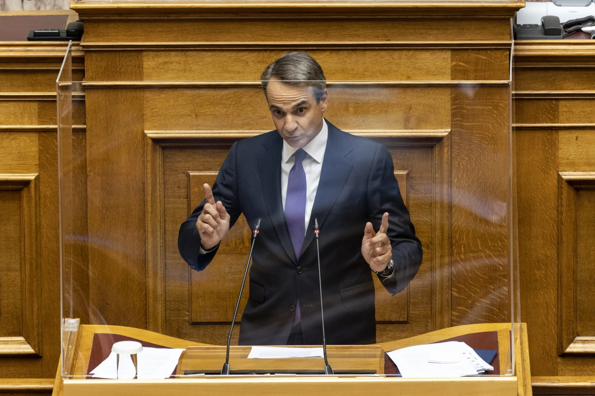 Kyriakos Mitsotakis speaks during a plenary session of parliament in Athens, Greece, on Aug. 26.