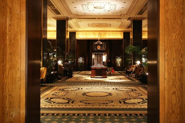 Entering New York's Waldorf Astoria Hotel