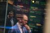 Monitors display stock market information as pedestrians are reflected in a window at the Nasdaq MarketSite in the Times Square area of New York, U.S., on Friday, Sept. 6, 2019. U.S. stocks advanced and Treasuries were mixed as Federal Reserve Chairman Jerome Powell’s latest comments did little to alter views on Federal Reserve policy.