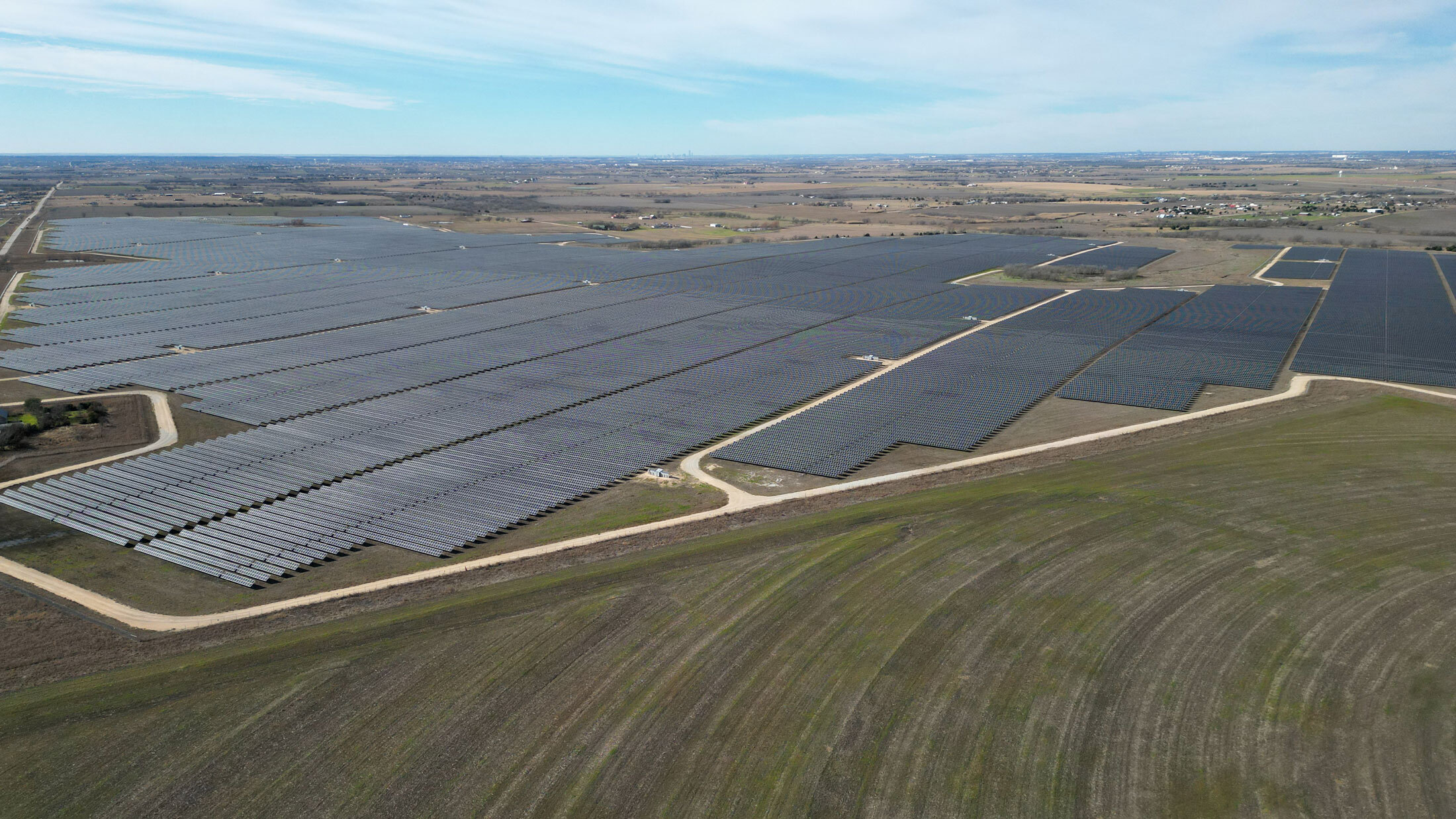 Farmland surrounds Duke Energy’s 932-acre Pflugerville Solar Farm in East Travis County, Texas.