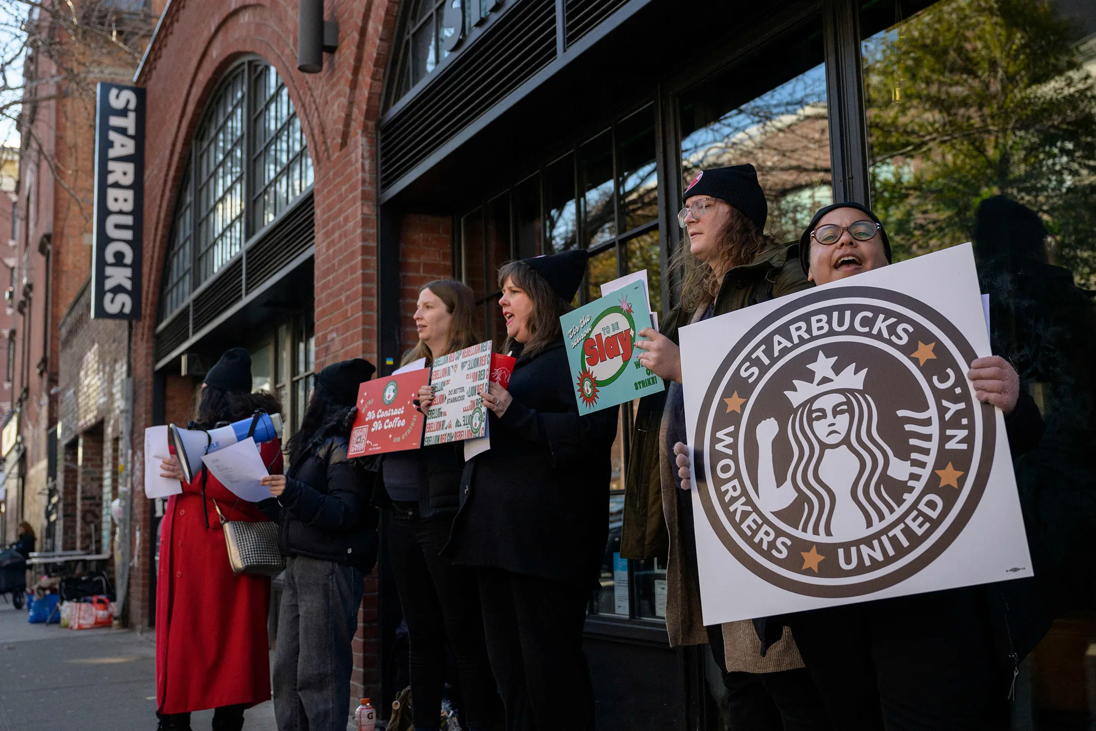 Starbucks workers strike outside a Starbucks coffee shop in the Brooklyn borough of New York on Nov. 17, 2022.