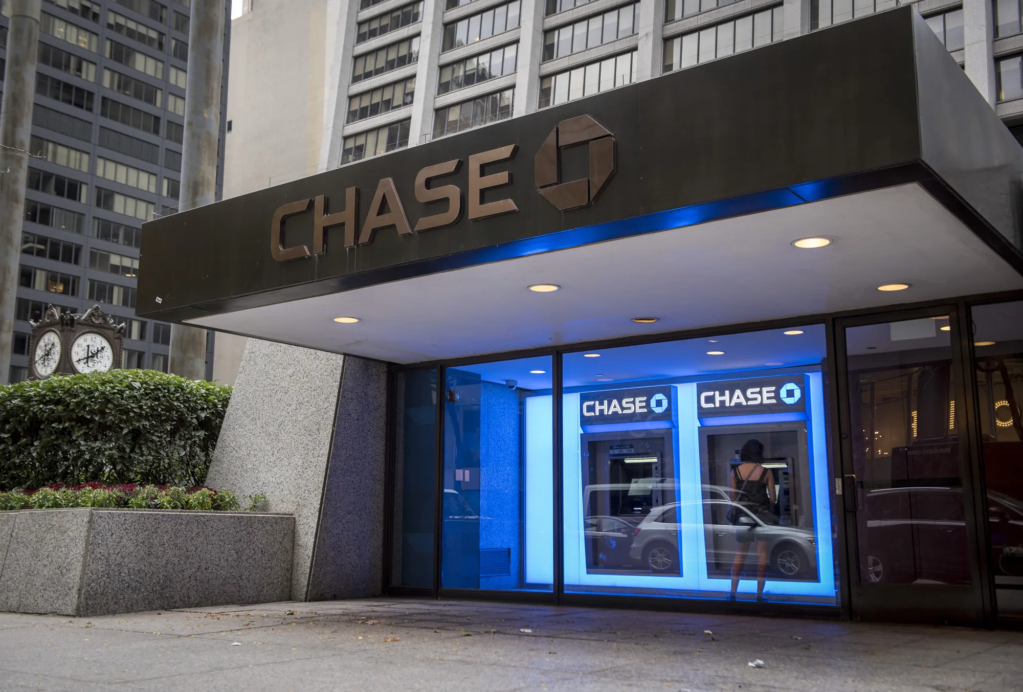 A customer uses an ATM&nbsp;inside a JPMorgan &amp; Chase bank branch kiosk in Chicago.