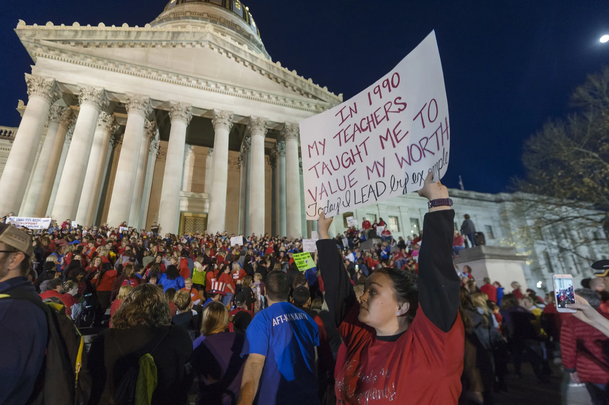 A special education teacher from Jackson County holds her sign outside of the capitol building&nbsp;in Charleston, West Virginia on&nbsp;Feb. 27, 2018.&nbsp;