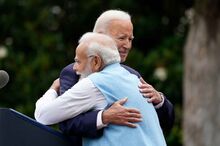 Joe Biden and Narendra Modi embracing.