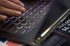 An attendee types on a cyrillic laptop computer keyboard at the CrytoSpace conference in Moscow, Russia, on Friday, Dec. 8, 2017. CryptoSpace is Eastern Europe's largest conference dedicated to blockchain technology and cryptocurrencies and runs Dec. 8-9.