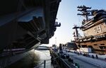 The USS Gerald R. Ford (CVN78) is seen next to the USS Dwight D. Eisenhower before the Ford commissioning ceremony at Naval Station Norfolk, Va., on Saturday, July 22, 2017.&nbsp;