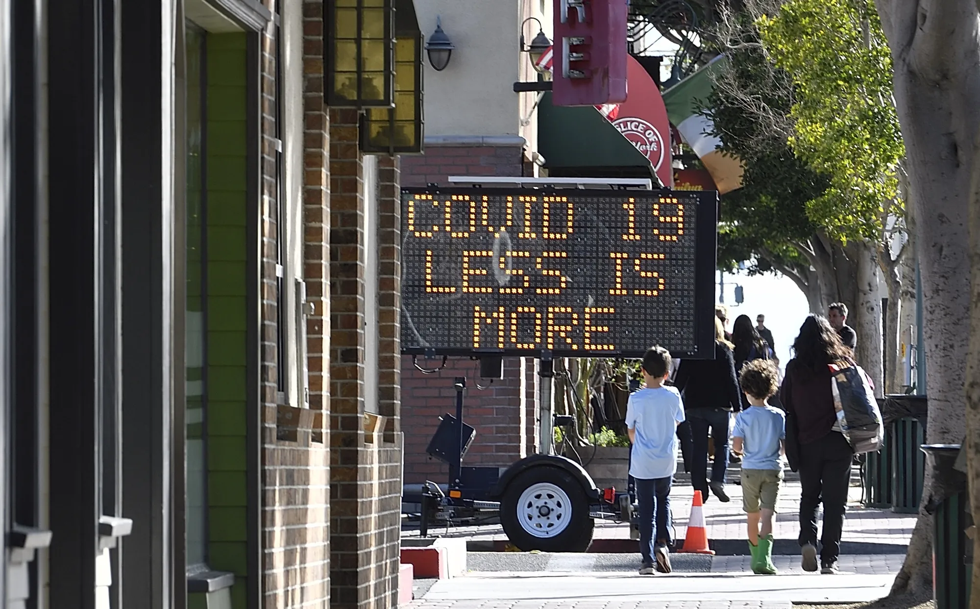 A coronavirus warning sign on Main Street in Seal Beach, CA, on&nbsp;March 17, 2020.&nbsp;