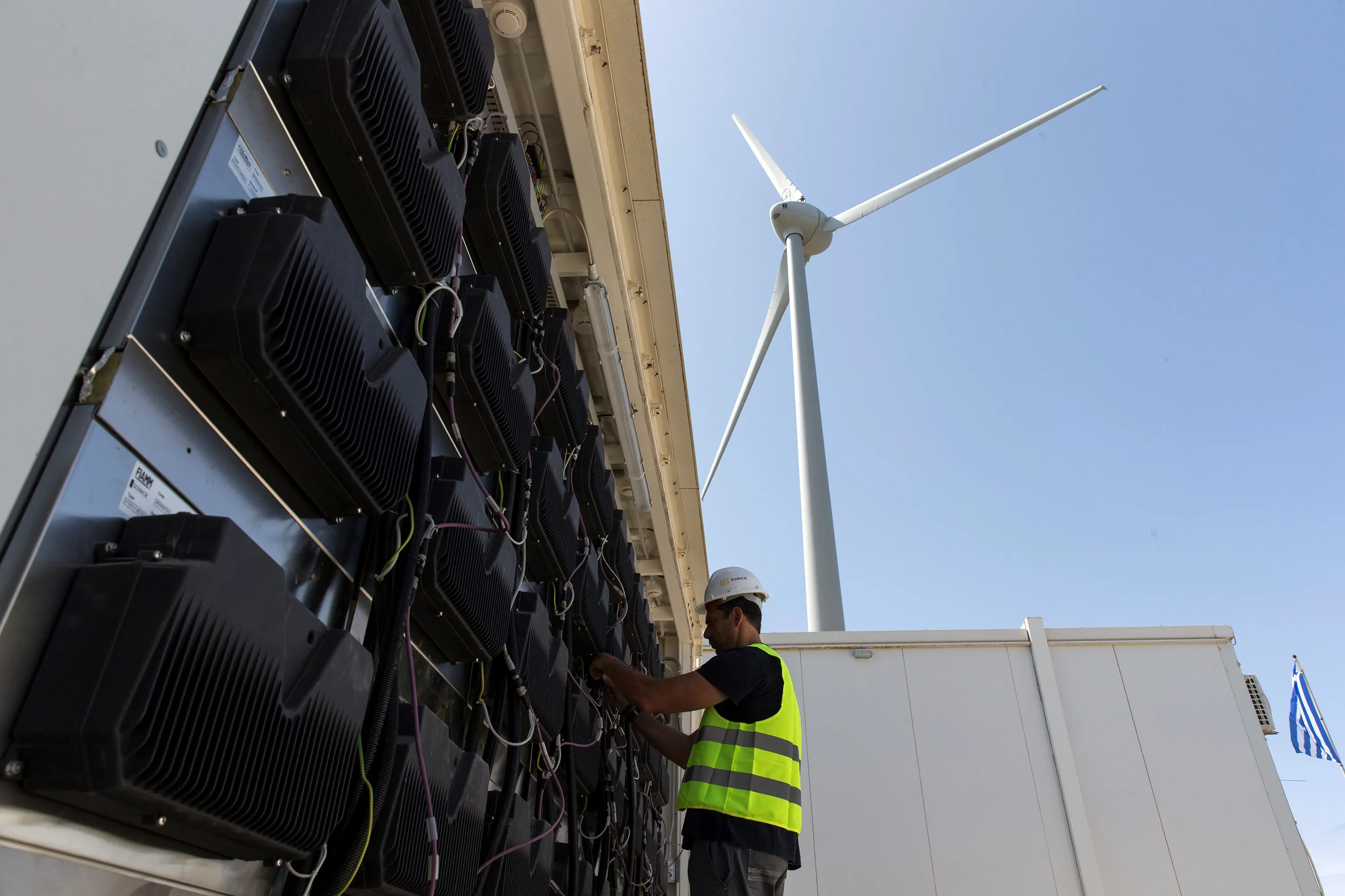 A person working on an energy storage system in Greece.