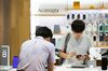 Customers try out the Samsung Electronics Co. Galaxy Note 8 smartphone at the company's D'light flagship store in Seoul, South Korea.