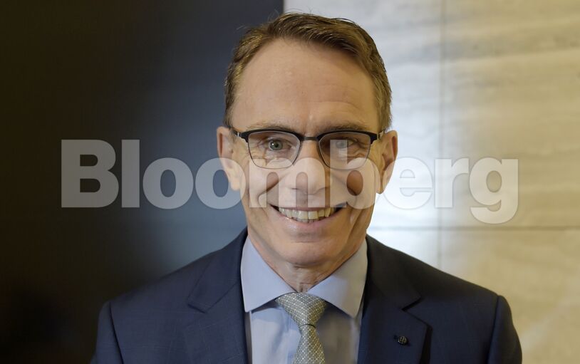 Portraits of BHP Billiton CEO Andrew Mackenzie as Company Reports Full-Year Results