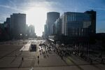 Office workers commute to work in the La Defense financial district of Paris, France.