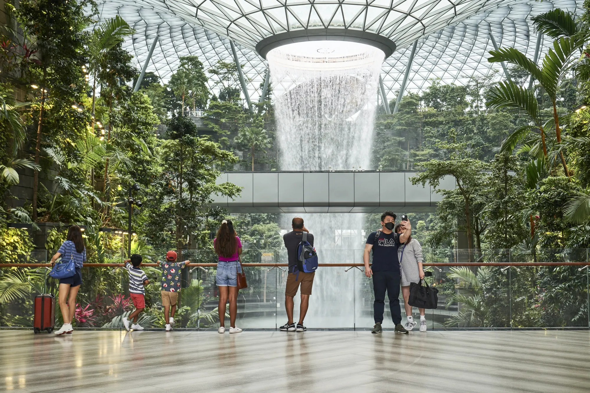 Travelers at Changi Airport in Singapore.