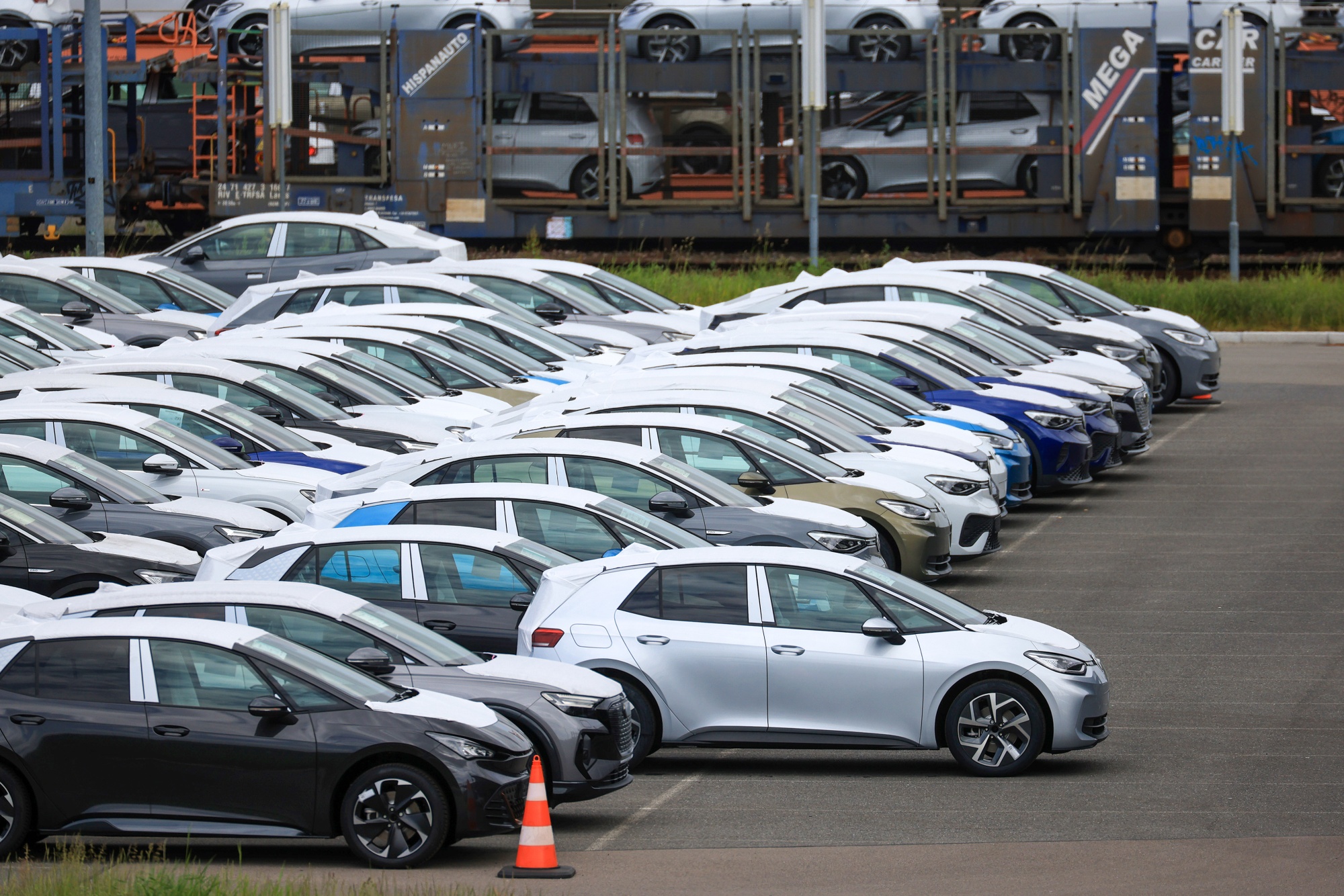 Newly-manufactured Volkswagen AG group electric vehicles (EV) in a storage lot at the Volkswagen Sachsen GmbH plant in Zwickau, Germany, on Wednesday, May 24, 2023. Auto sales in Europe rose in April for a ninth month as supply chains improved and carmakers worked through backlogs of orders. Photographer: Krisztian Bocsi/Bloomberg
