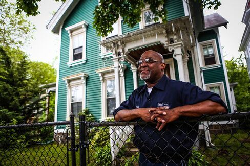 Douglass in front of his home in New Haven, Connecticut.