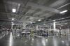 Machinery stands inside the Tesla Motors Inc. Gigafactory in Sparks, Nevada, U.S., on Tuesday, July 26, 2016. Tesla officially opened its Gigafactory on Tuesday, a little more than two years after construction began. The factory is about 14 percent complete but when it's finished, it will be about 10 million square feet, or about the size of 262 NFL football fields.