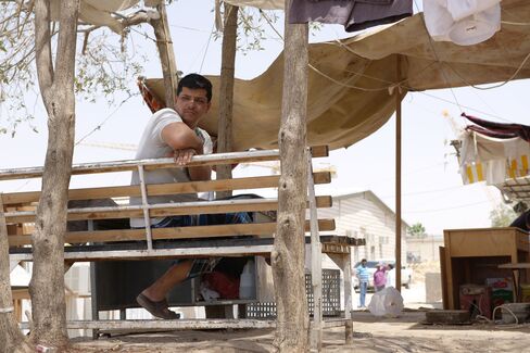 A worker sits on a bench in a Saudi Oger labor camp in Riyadh.