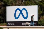 A security dog is walked around signage at Meta Platforms headquarters in Menlo Park, California, U.S., on Friday, Oct. 29, 2021. 