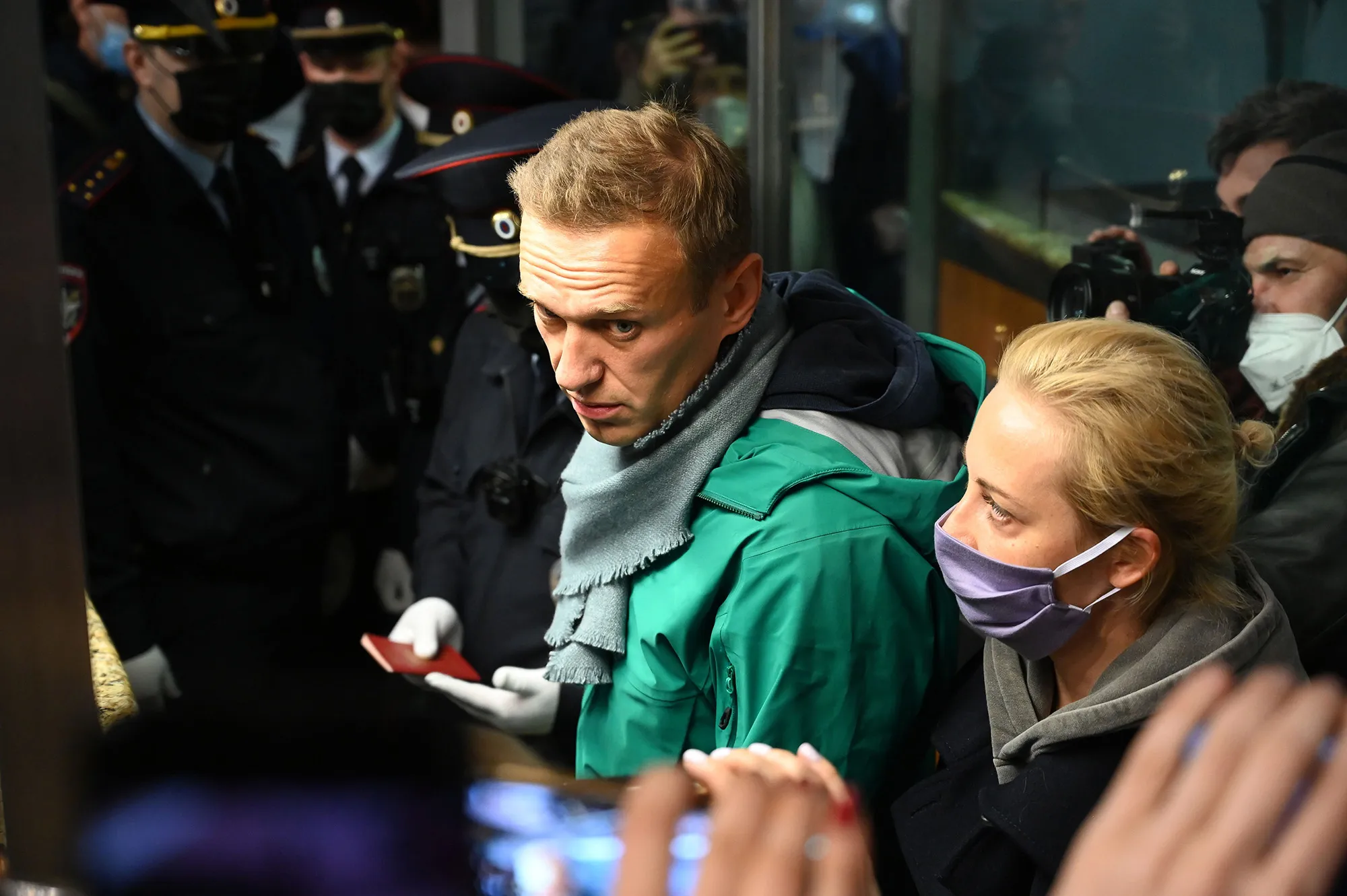 Alexei Navalny and his wife Yulia are seen at the passport control point at Moscow's Sheremetyevo airport on Jan. 17, 2021.
