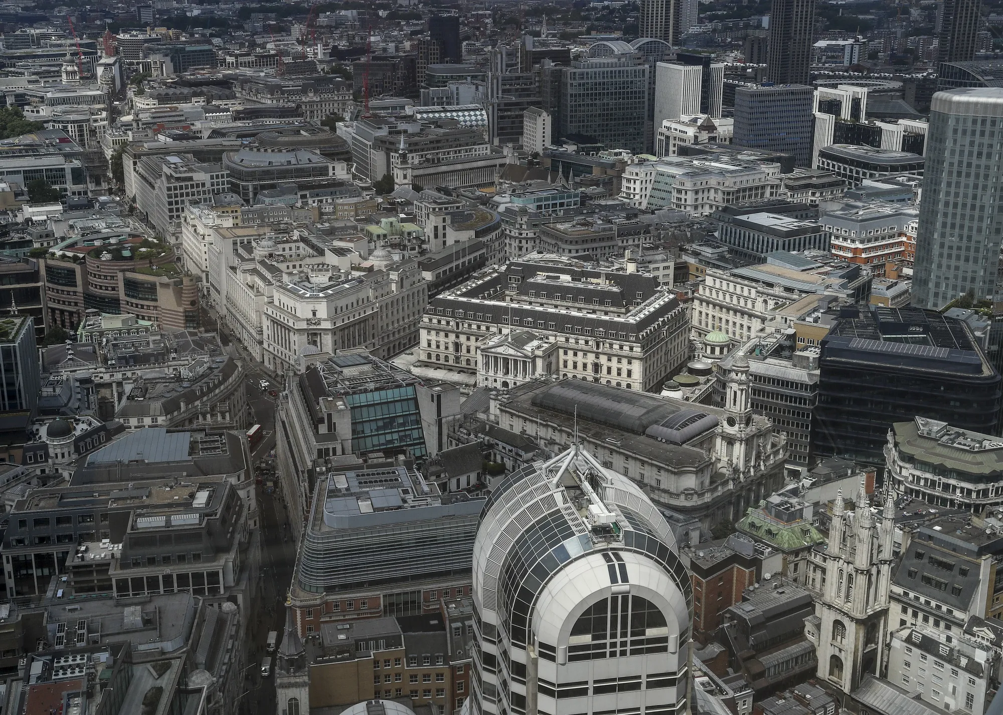 The Bank of England, center, stands in the City of London square mile financial district in London, U.K.