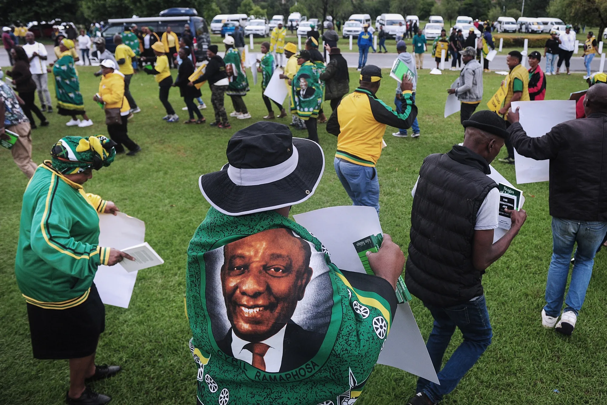 A supporter of Cyril Ramaphosa wears a flag bearing his image outside a gathering of African National Congress&nbsp;leaders in Johannesburg, South Africa, on Dec. 5.