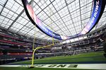 Crews work on field preparation for Super Bowl LVI at SoFi Stadium in Inglewood, California.