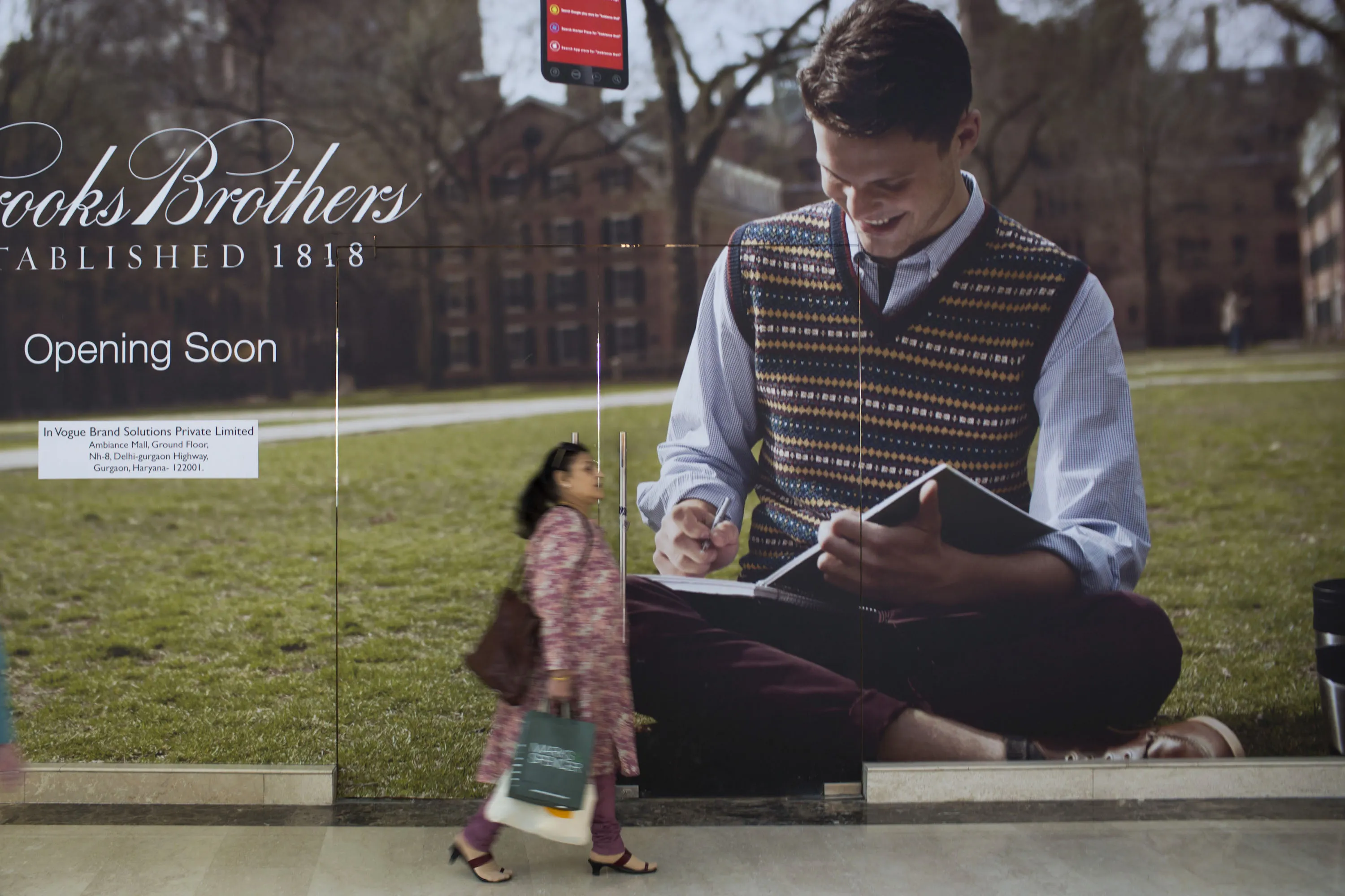 A shopper walks past a future Brooks Brothers Inc. store in Gurgaon, India, in 2012.&nbsp;