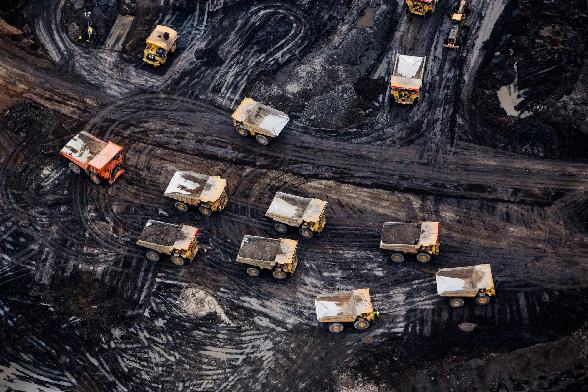 Heavy haulers at the Athabasca oil sands near Fort McMurray, Alberta, Canada.