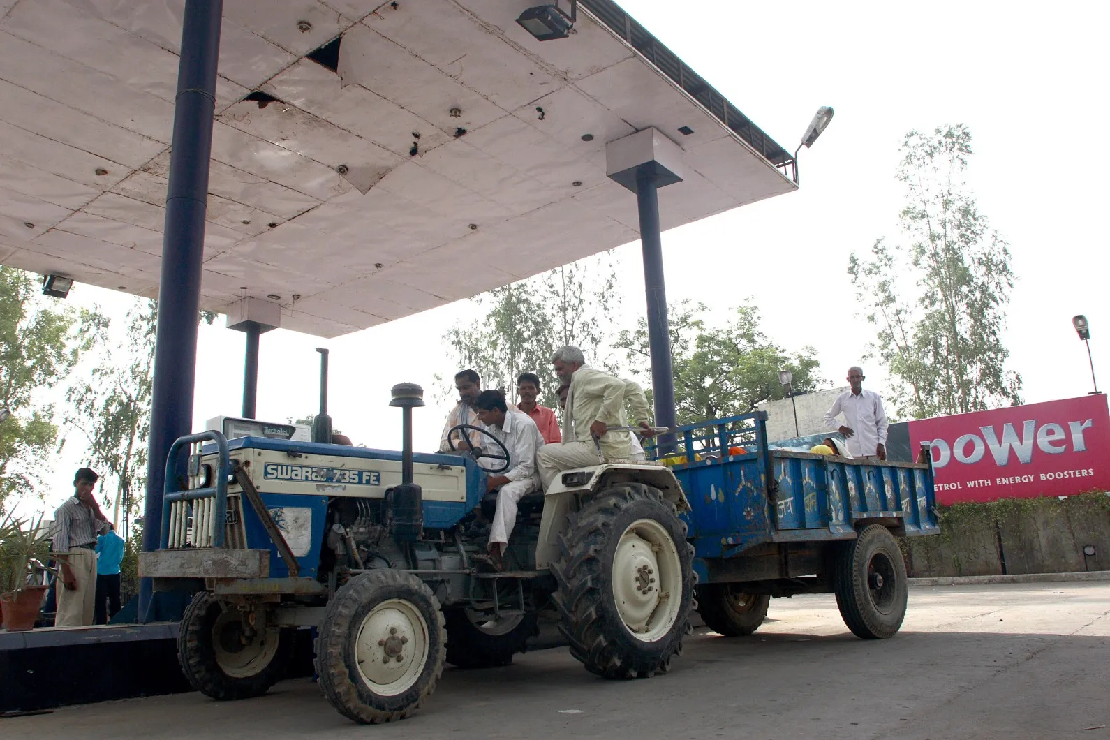 Villagers fill their tractor at a Hindustan Petroleum Corp. station in rural Uttar Pradesh. The agricultural sector is the second-biggest consumer of diesel after transportation.