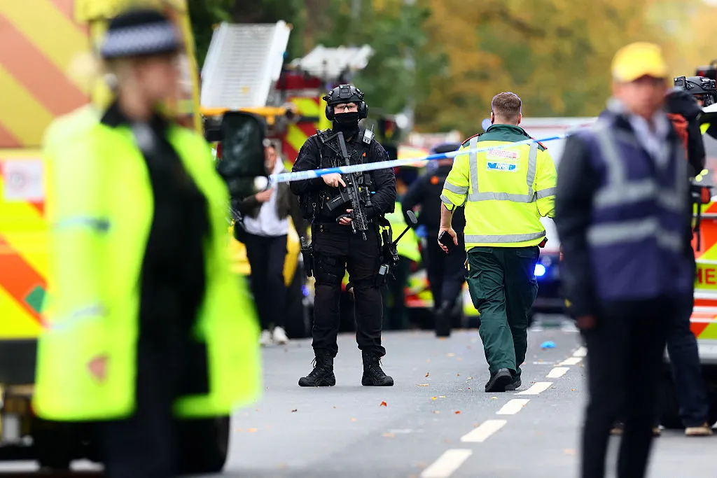 Armed police inside a Police cordon near Heaton Park Hebrew Congregation synagogue in Crumpsall, Manchester, on Oct. 2.