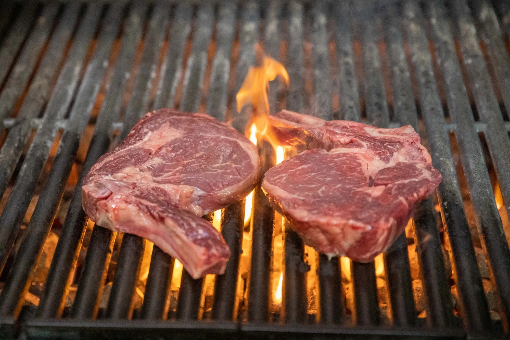 Steak is prepared for a takeaway order.