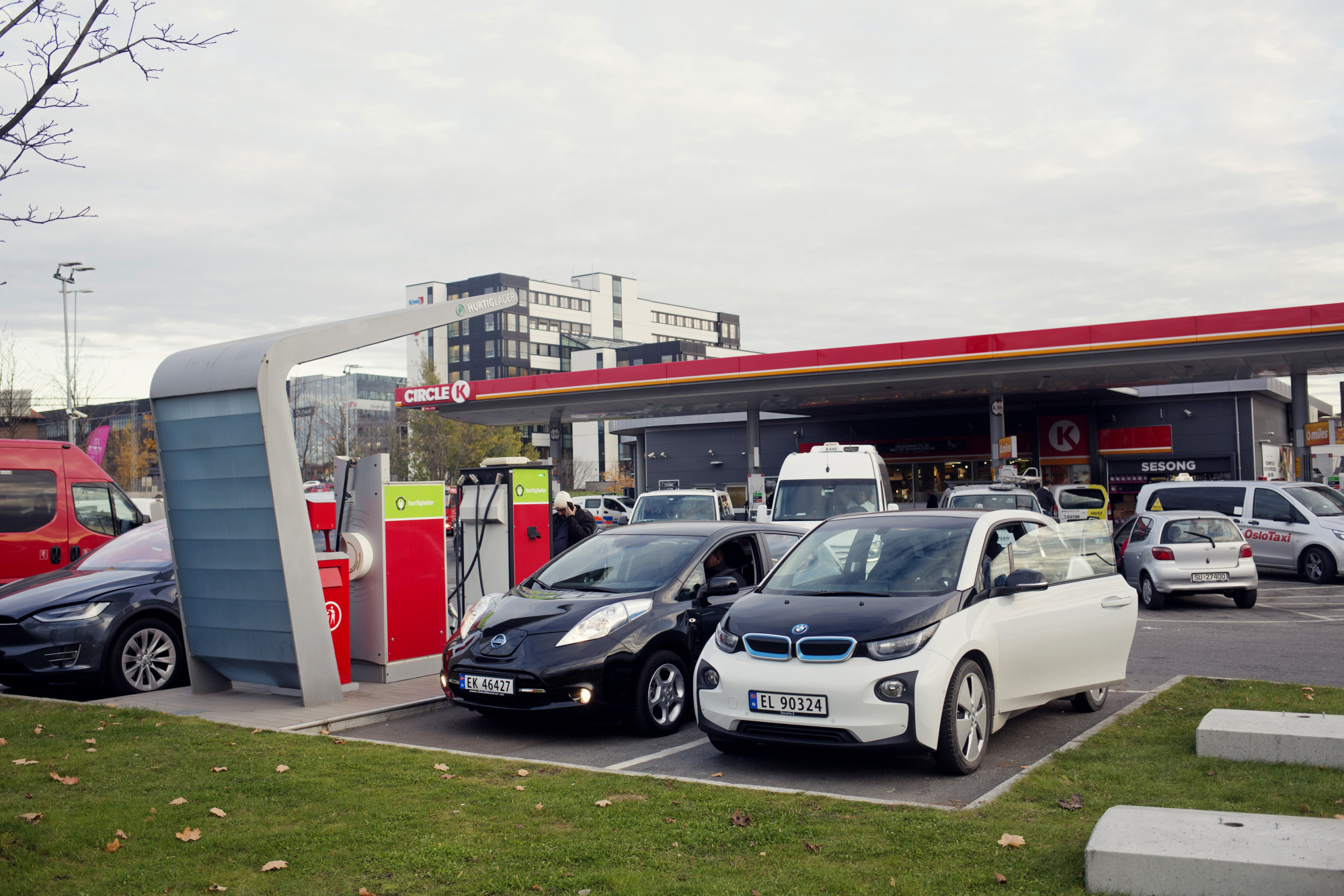 An electric vehicle charging station near a gas station in Oslo, Norway.