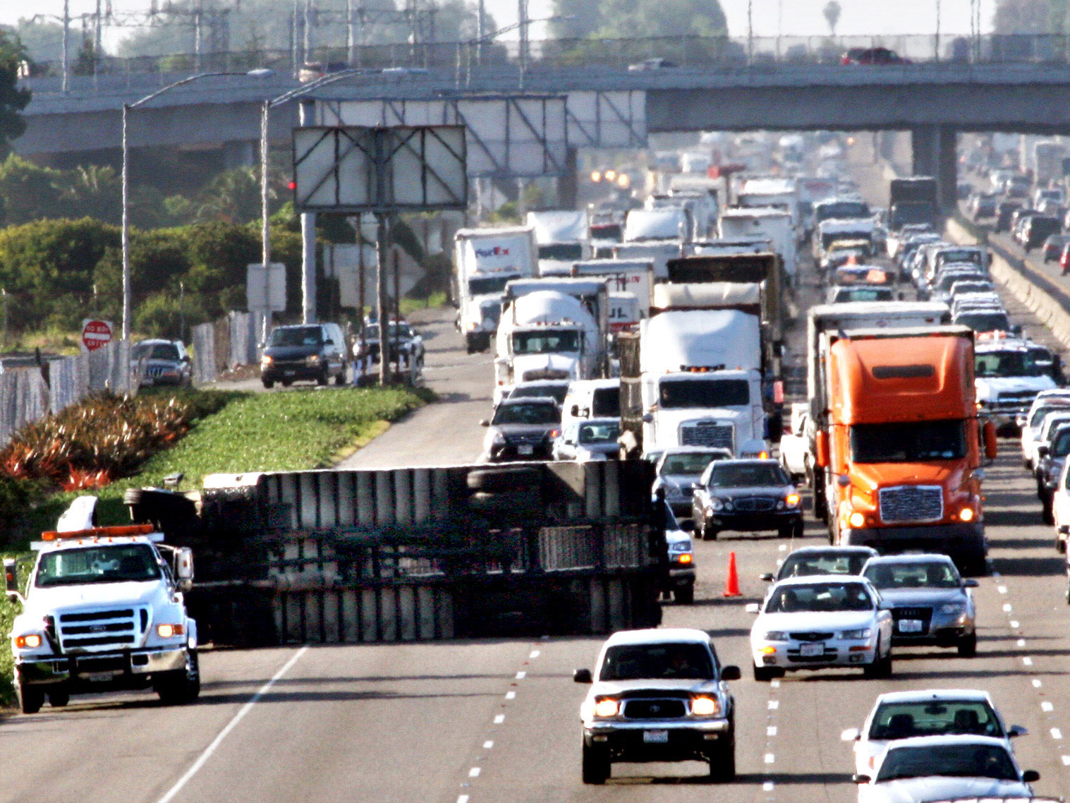 Atlanta is the fatal center of the U.S. truck rollover syndrome, but the problem is nationwide. Above, a rollover near San Francisco backs up highway traffic at rush hour for nearly 10 miles.
