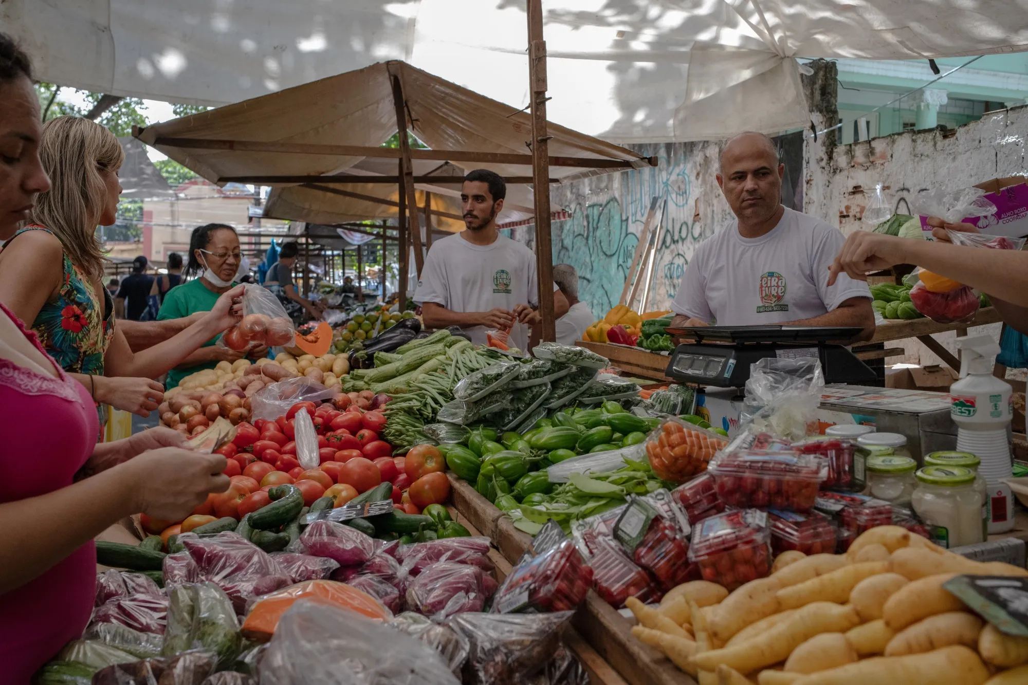 Shoppers browse produce at an outdoor market in Rio de Janeiro, Braziil.