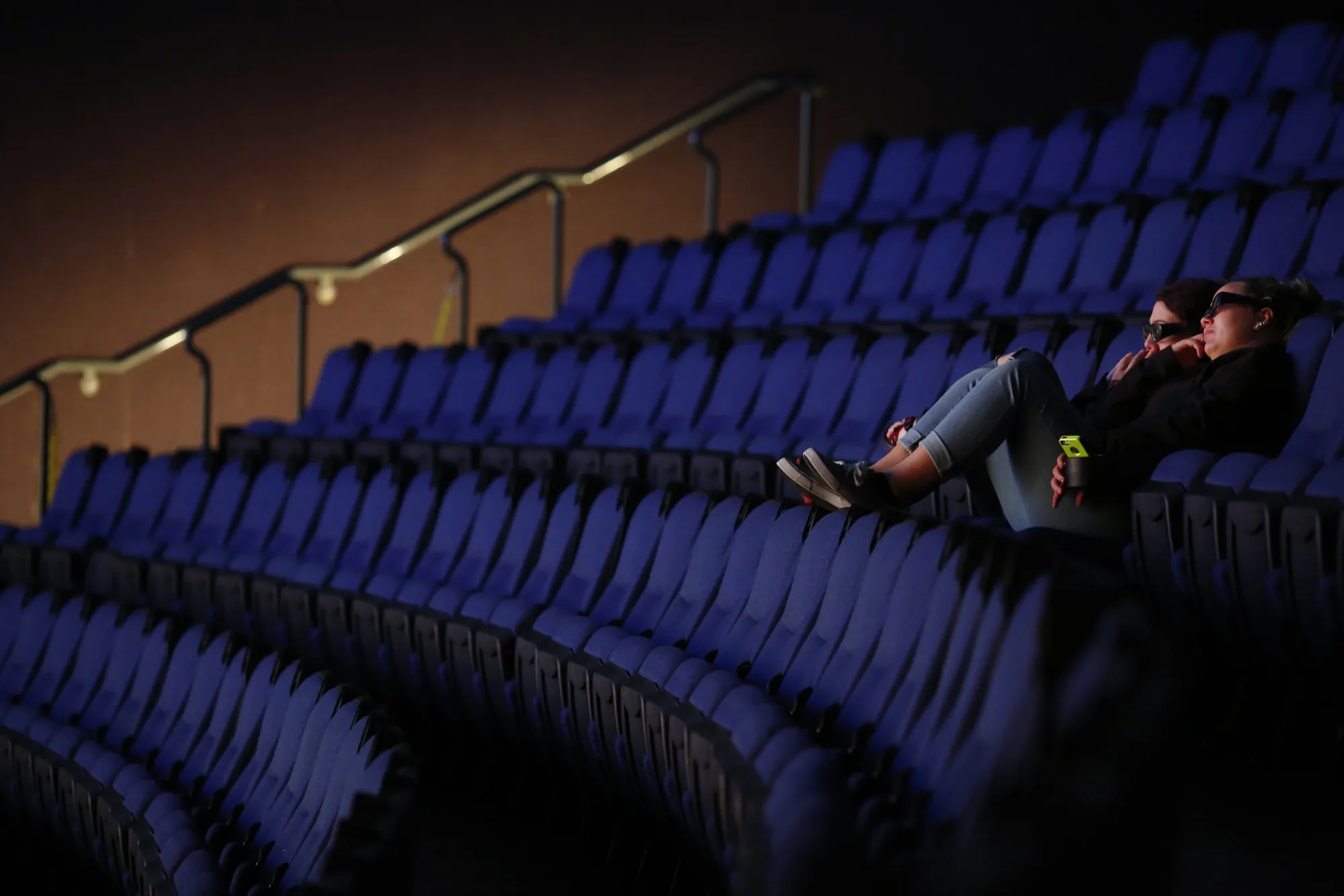 Audience members watch a 3D movie at a movie theater in Chattanooga, Tenn.