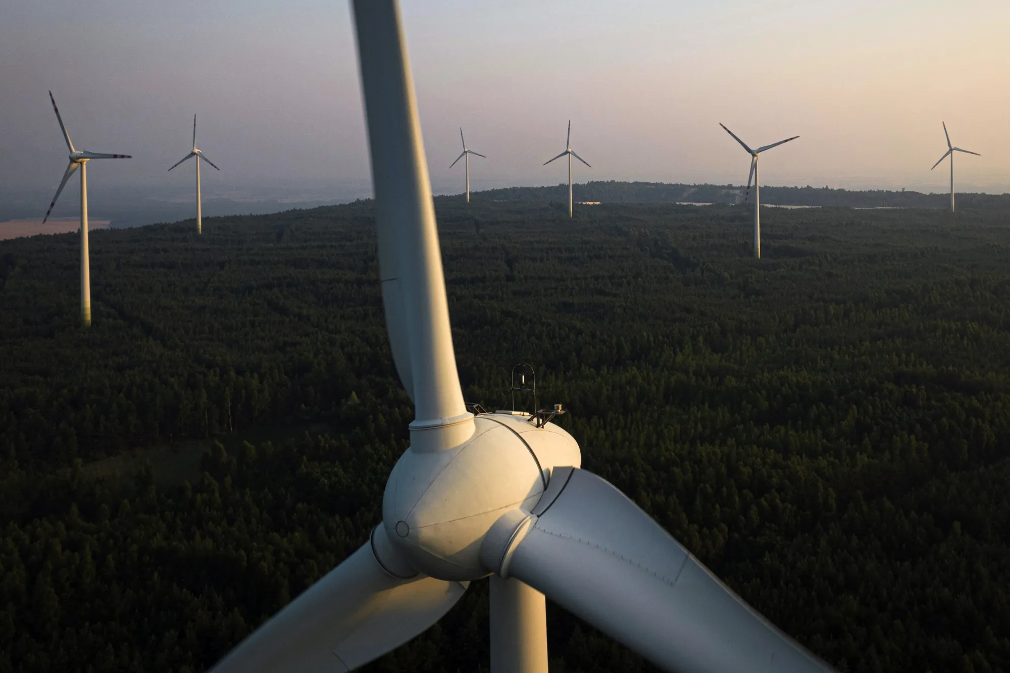 Wind turbines operate at the Kamiensk wind farm&nbsp;in Kamiensk, Poland.