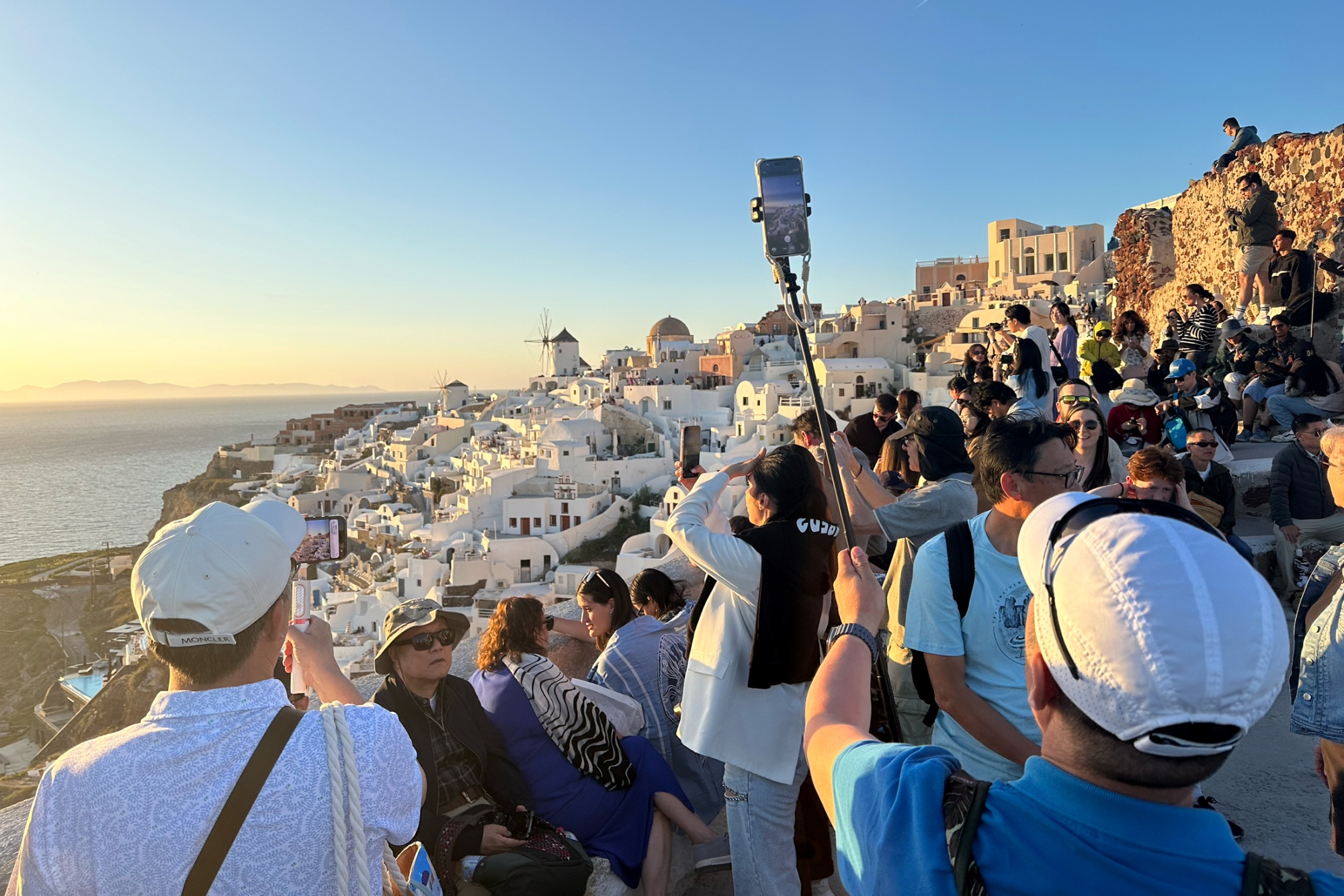 Selfie-snappers in Santorini, Greece in April 2026.