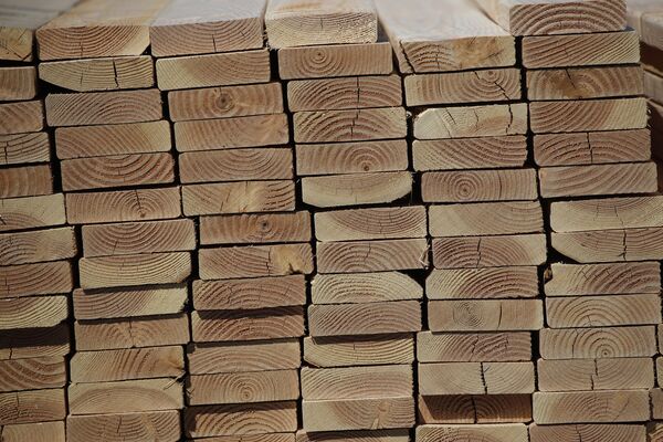 Cut Timber Stacked At A Lumber Yard